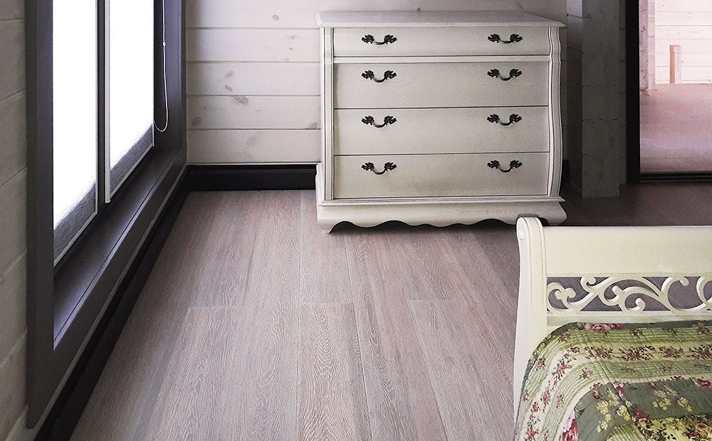 Schlafzimmer im Blockbohlenhaus